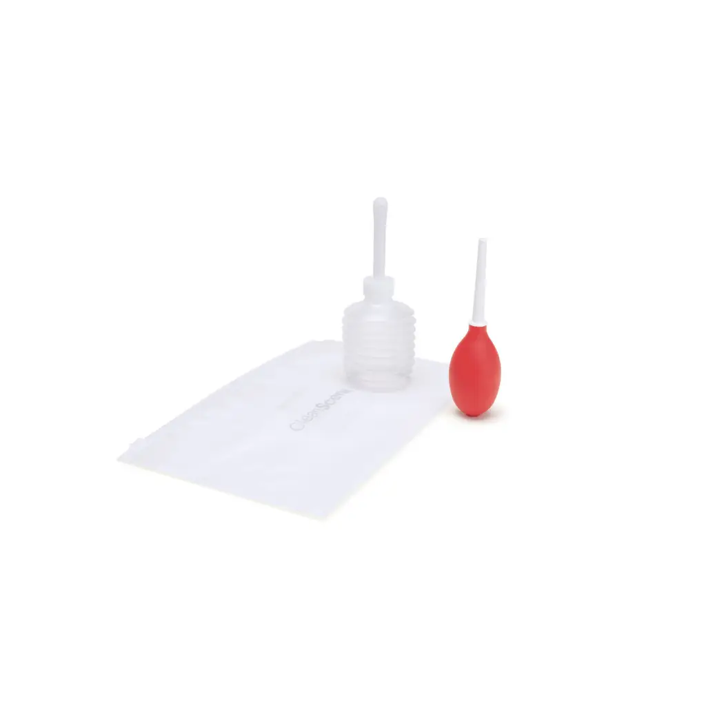 Red toothbrush and plastic bottle on white surface - CleanScene Mini Travel Douche accessory