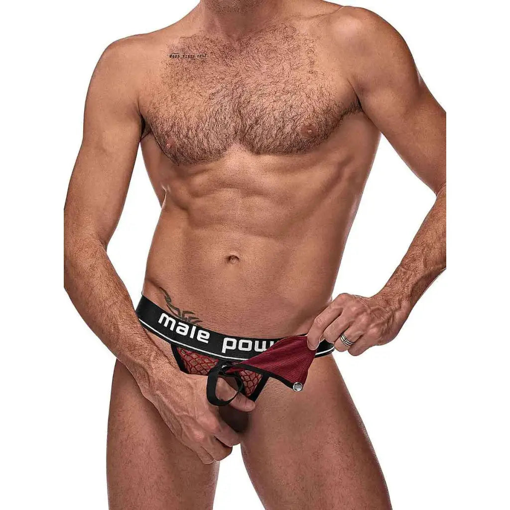 Shirtless male torso in red ’Cock Pit Cock Ring Jock’ underwear with ’male power’ waistband