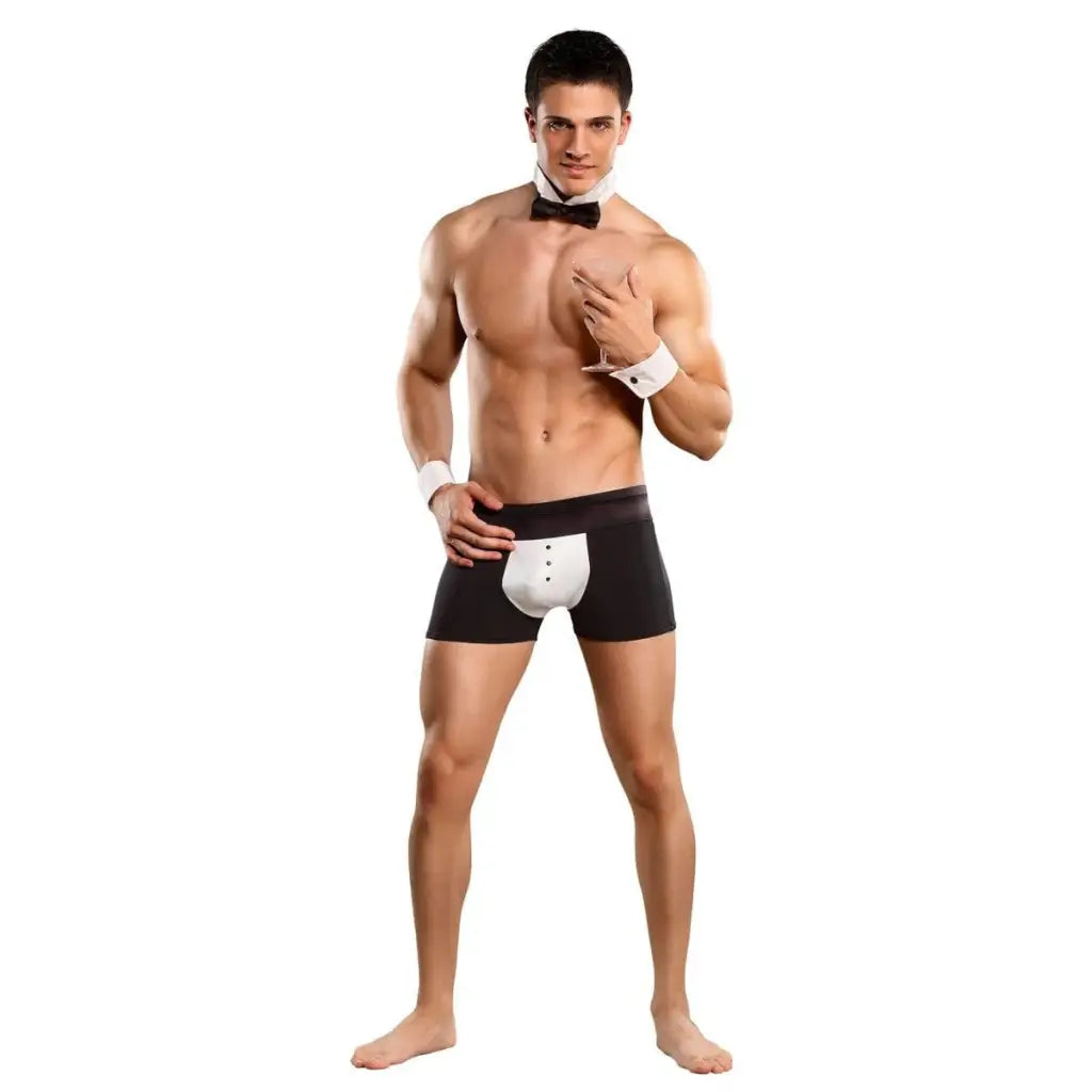 Muscular shirtless man in Costume Butt-ler Black S/m with bow tie, cuffs, and tight shorts