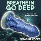 Blue textured silicone dildo shaped like a tentacle with suction cup base for water-based lubricants