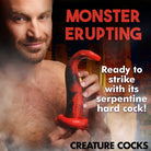 A man holding a red snake promoting the Creature Cocks King Cobra Silicone Dildo