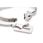 Cuffed locking bracelet paired with a key necklace in durable tungsten steel