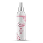 A bottle of Desire by Swiss Navy Toy & Body Cleaner with pink flowers