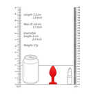 Ruler with red and white handles beside Diamond Heart Butt Plug for precise measurement