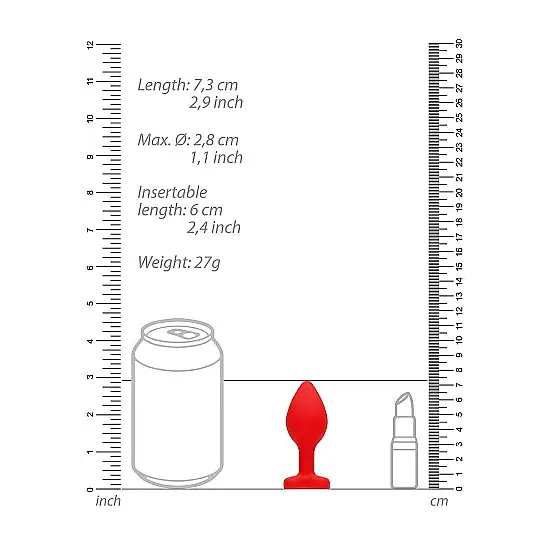 Ruler with red and white handles beside Diamond Heart Butt Plug for precise measurement