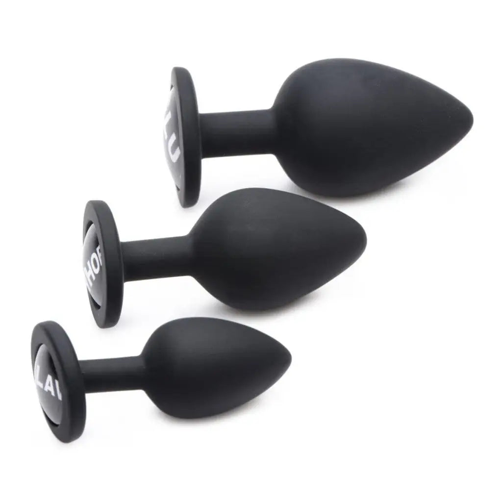 Dirty Words Anal Plug Set: A pair of black plastic knobs from the words anal plug collection