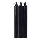 Three tall, black Doc Johnson Japanese drip candles with visible wicks