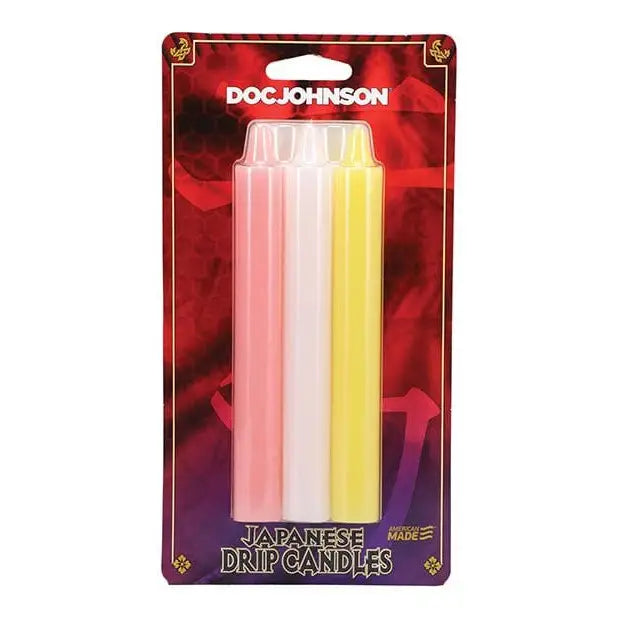 Three colorful cylindrical Japanese drip candles in a retail pack - Doc Johnson Japanese Drip Candles