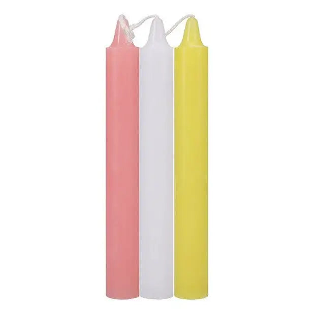 Japanese drip candles: Three tall, cylindrical candles in pink, white, and yellow colors