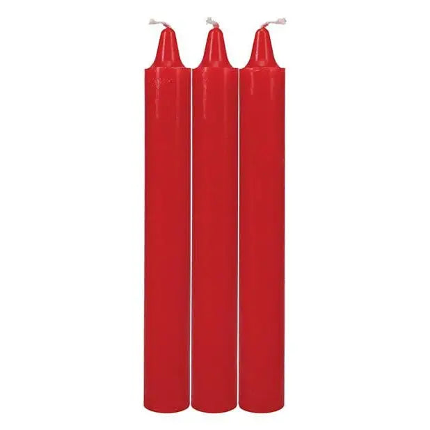 Three tall, slender red candles with white wicks from Doc Johnson Japanese Drip Candles