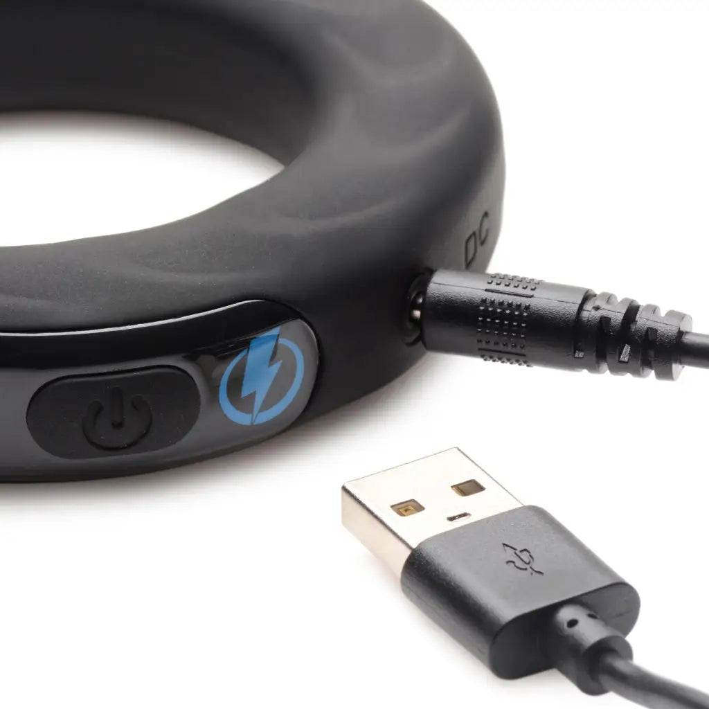 USB cable connected to E-stim Pro Silicone Vibrating Cock Ring for seamless usage