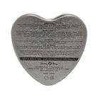 Heart-shaped metal tin of Earthly Body Sun Touched Tropical Edible Candle with printed info