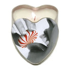 Heart-shaped candle container with hands holding a peppermint candy - Earthly Body Suntouched