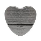 Heart-shaped tin of Earthly Body Suntouched Hemp Edible Candle with instructions