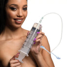 Enema syringe with tapered tip and silicone tube for precise medical administration