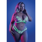 Curvaceous woman in Fantasy Lingerie Glow Night Vision set posing in vibrant lighting