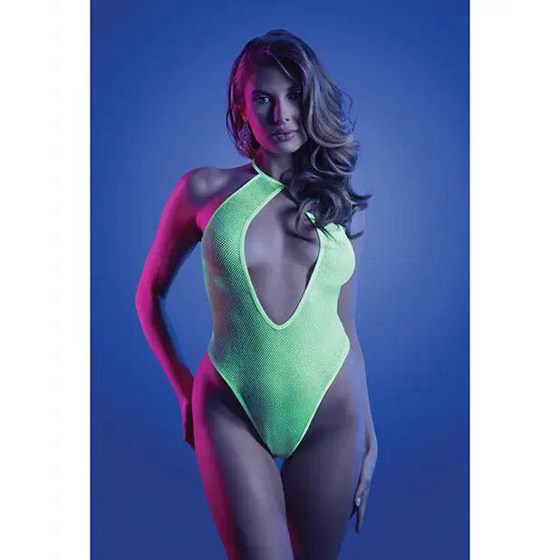 Woman in neon green Fantasy Lingerie Glow Nocturnal Keyhole swimsuit with dramatic lighting