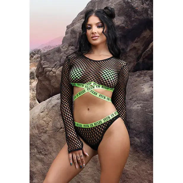 Woman modeling Fantasy Lingerie Vibes Fuck Ur Rules outfit with cross pasties and fishnet top