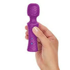 Hand holding the Femme Funn Ultra Wand Mini, a purple toy for versatile pleasure