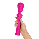 Hand holding Femme Funn Ultra Wand XL pink toy for ultimate pleasure