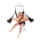 A woman in a black bikini sits on a chair for the Fetish Fantasy Series Spinning Fantasy Swing