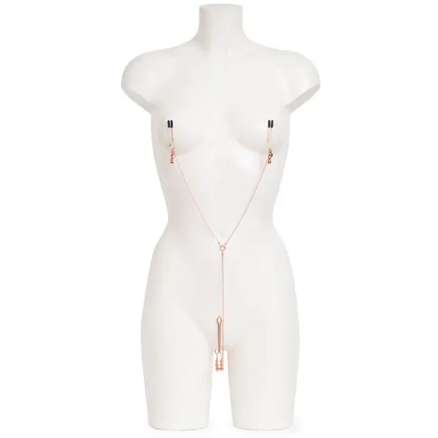 White mannequin wearing Fifty Shades Freed rose gold necklace with pendant