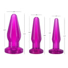 Three purple butt plugs with varying max insertable diameters on a white background