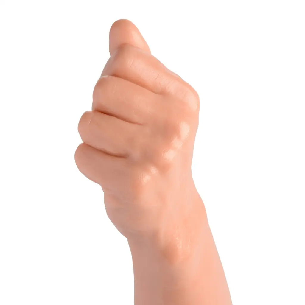 A hand with a thumb on it demonstrating the Fisto Clenched Fist Dildo realism