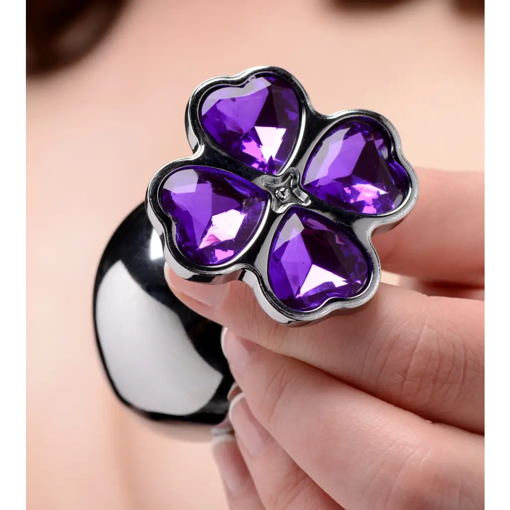 Purple gemstone flower hearts anal plug set with four heart-shaped petals, inches insertable length