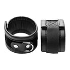 Frisky ’Handle Me’ wrist cuffs: Black leather with metal hardware and elastic bands