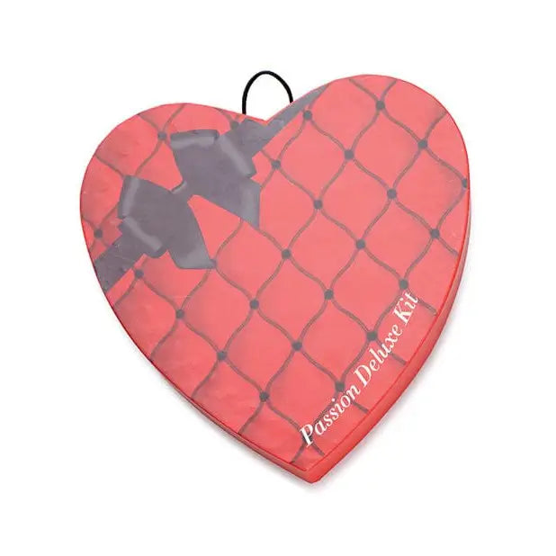 Passion Deluxe Kit in heart-shaped box with fishnet pattern and ’Passion Deluxe Kit’ text