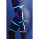 Glow ’Buckle Up’ dark leg harness by Fantasy Lingerie against a dark background