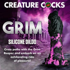 A grim silicone dildo shaped like a black and purple grim reaper from Creature Cocks