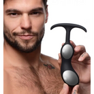 Person holding Heavy Hitters Premium Silicone Weighted Prostate Plug in hand