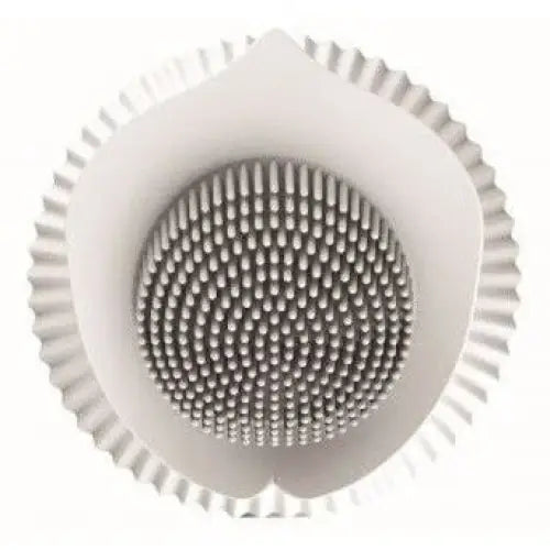 Flower-shaped inBloom Lilium massaging vibrator with a circular white plastic drain cover