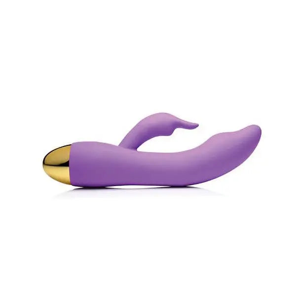 Purple and gold-colored Inmi 10x focus silicone vibrator for personal use