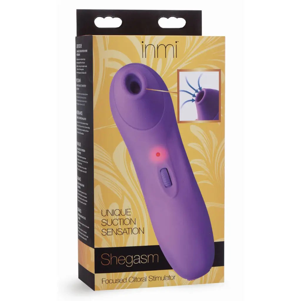 Inmi Shegasm Focused Clitoral Stimulator: Purple silicone device with suction in packaging