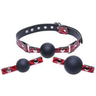 Interchangeable silicone ball gag with red leather straps and three black silicone balls