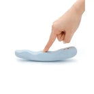 Hand pointing at iroha MINAMO, a wavy rechargeable vibrator by TENGA