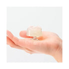 Iroha Petit Lily By Tenga - Clear held in a person’s palm, showcasing its translucent design