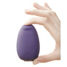 A hand holds Je Joue Mimi Soft Fuchsia Vibrator, a low frequency clitoral stimulator