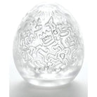 Transparent Keith Haring Tenga Egg with intricate etched designs for unique pleasure