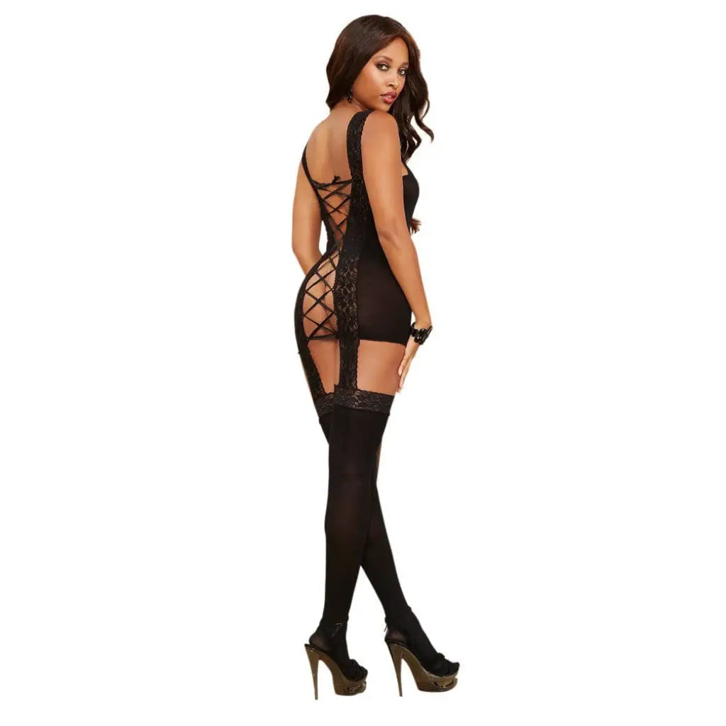 Woman in lace-up back garder dress attached stocking, thigh-highs, and high heels