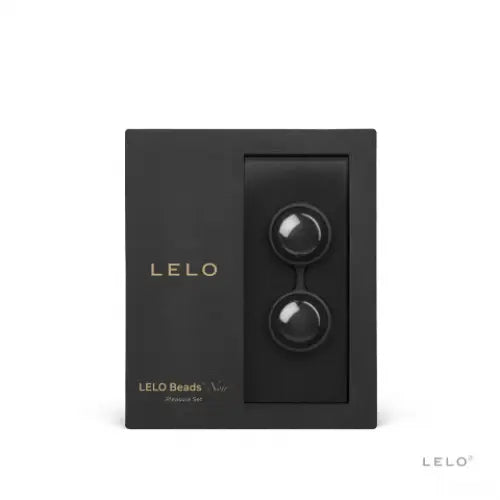 The LELO Beads Noir Ben Wa Balls with a stylish Leloo black and gold watch beside them