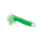 Green plastic screw next to Lollicock Glow-in-the-Dark Silicone Dildo with Balls 7in Green