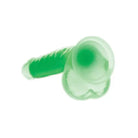 Green plastic ear plug with Lollicock Glow-in-the-Dark Silicone Dildo w/ Balls 7in Green