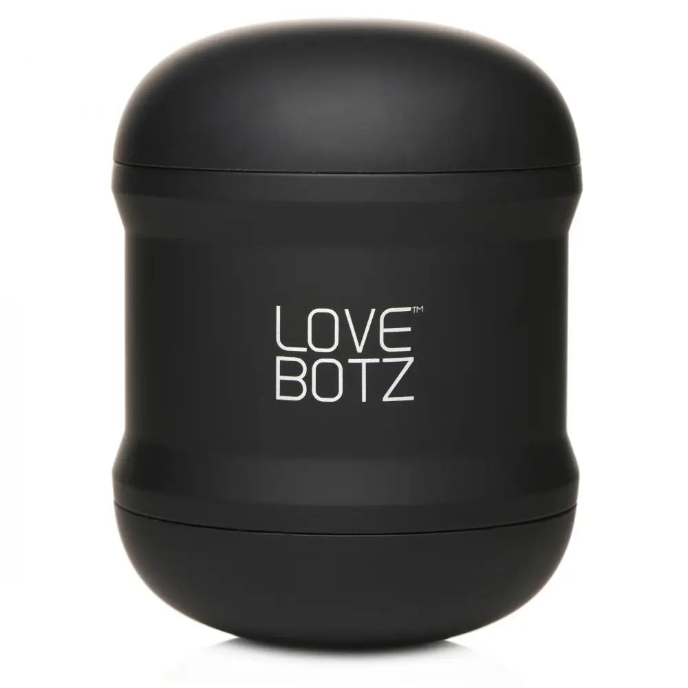 Black cylindrical LoveBotz 10X Cyber Stroke Vibrating Masturbator in white text label