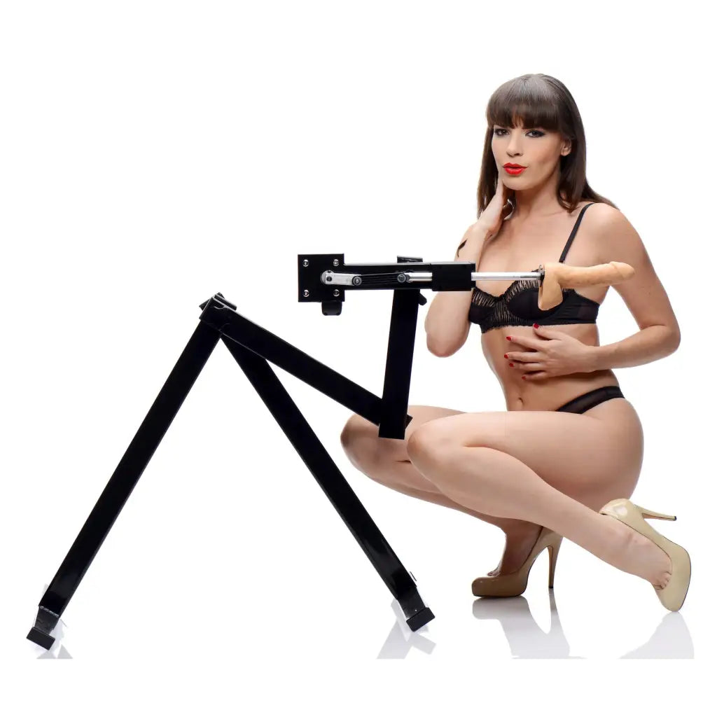 A woman in lingerie on a desk with the LoveBotz Matrix Multi-Angle Sex Machine