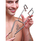 Smiling person holding a Master Series Dartigues Retractor Medical Hole Spreader