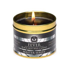 Lit black Fever Drip Candle in gold-rimmed tin from Master Series - Series Fever Drip